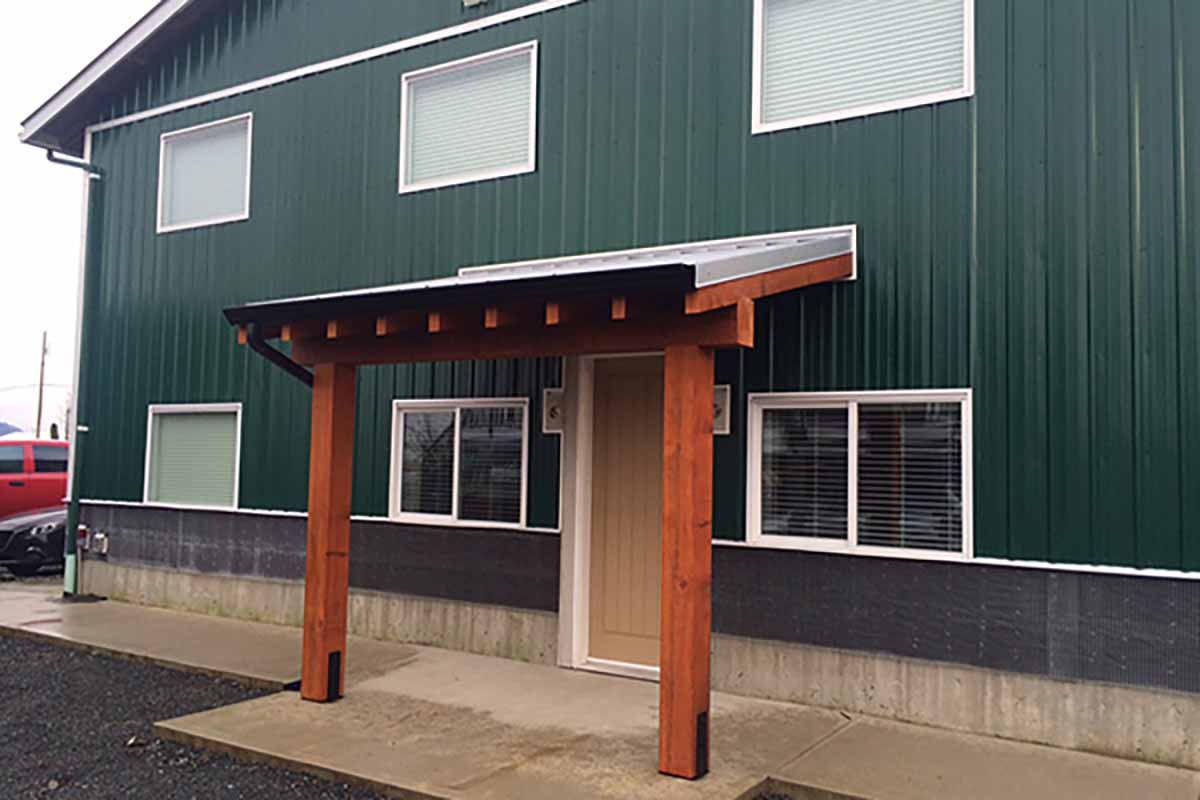 Industrial office renovation in existing warehouse, including office space, front entry and sidewalks.