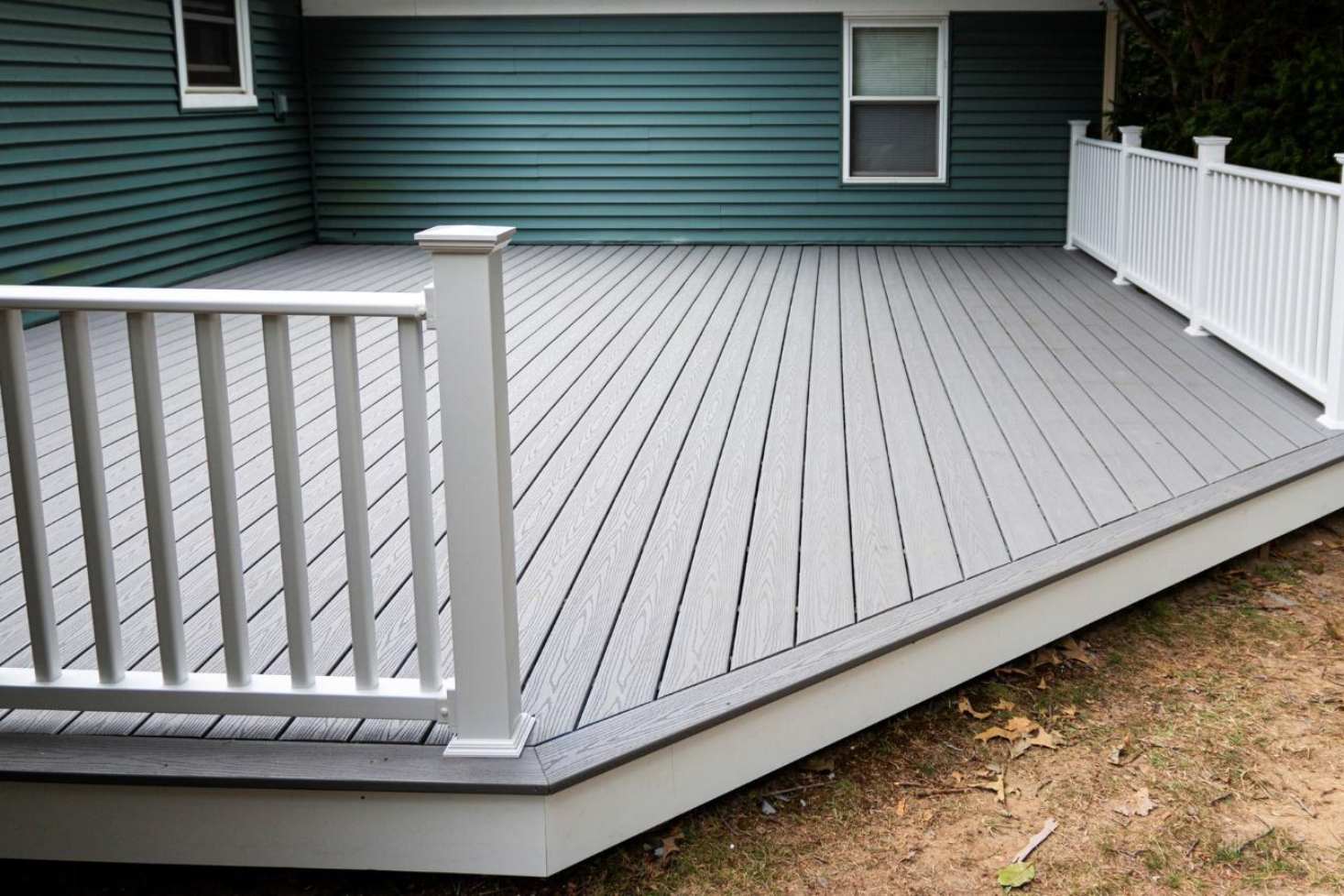 A new composite deck at the back of a house