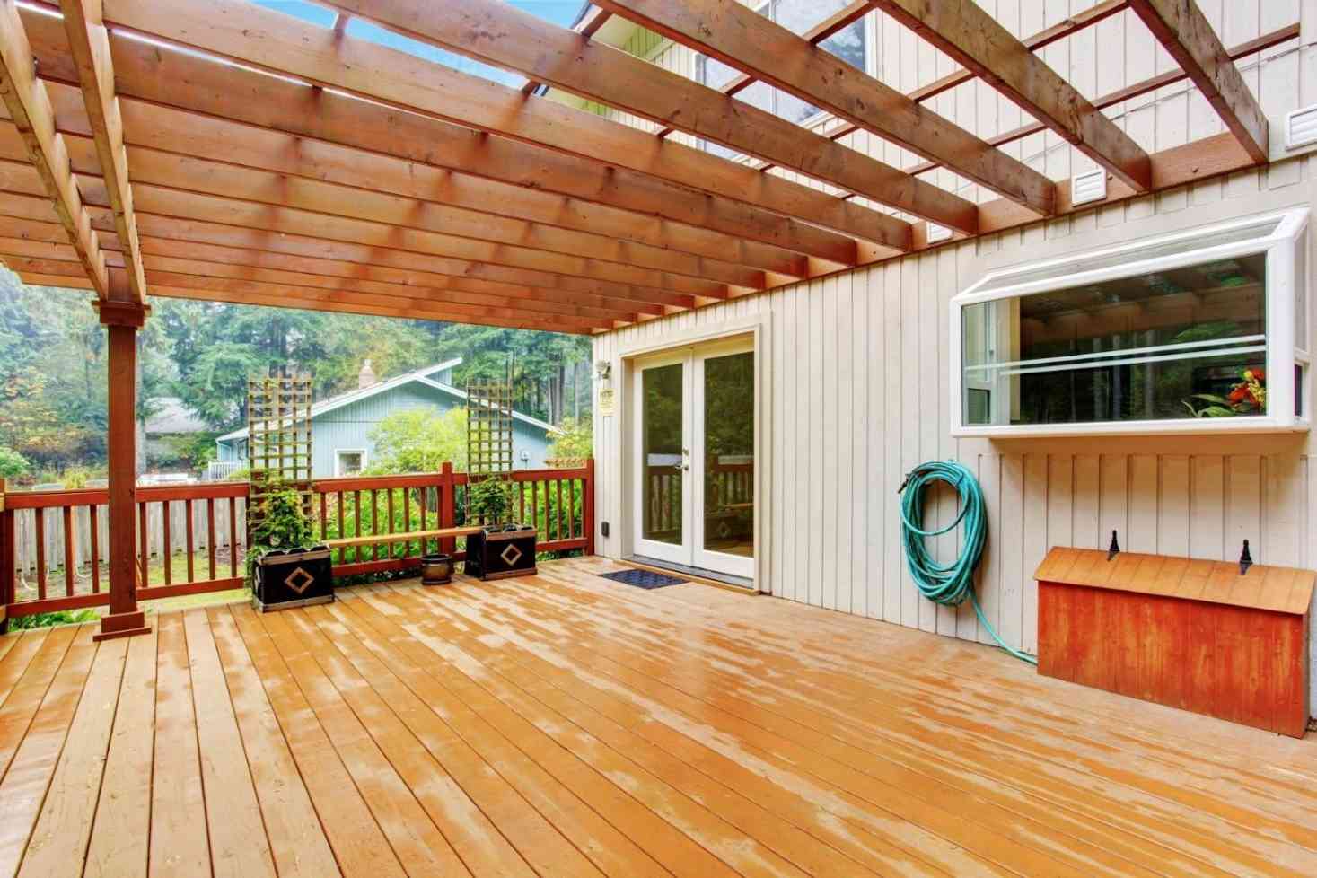 Wooden deck with pergola; residential home